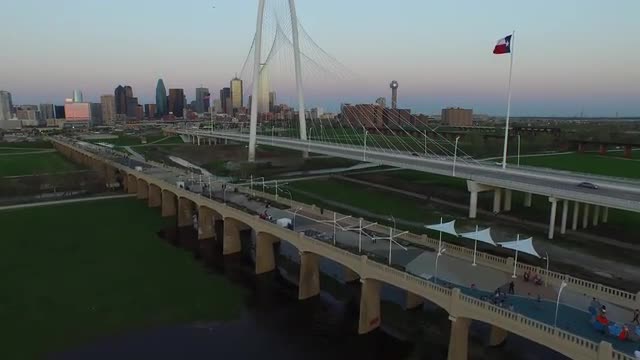 The Texas State Flag and The Margaret Hunt Hill Bridge over Singleton Boulevard in Downtown Dallas