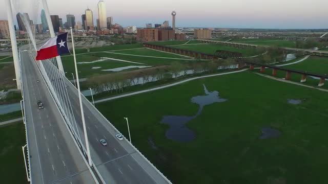 The Texas State Flag and The Margaret Hunt Hill Bridge over Singleton Boulevard in Downtown Dallas
