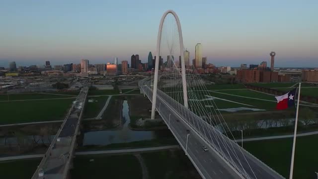 The Texas State Flag and The Margaret Hunt Hill Bridge over Singleton Boulevard in Downtown Dallas