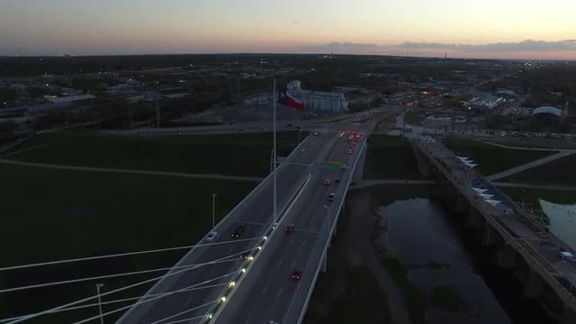 The Texas State Flag flying over The Margaret Hunt Hill Bridge in Downtown Dallas