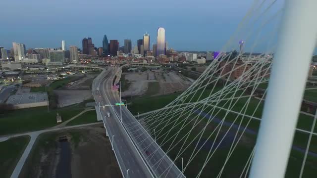 The United States Flag flying over The Margaret Hunt Hill Bridge in Downtown Dallas