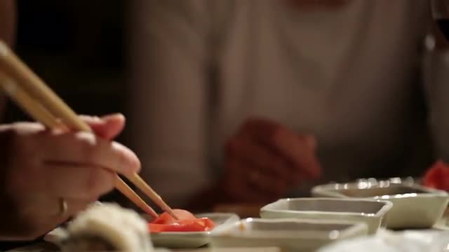 Eating sushi. Close up.