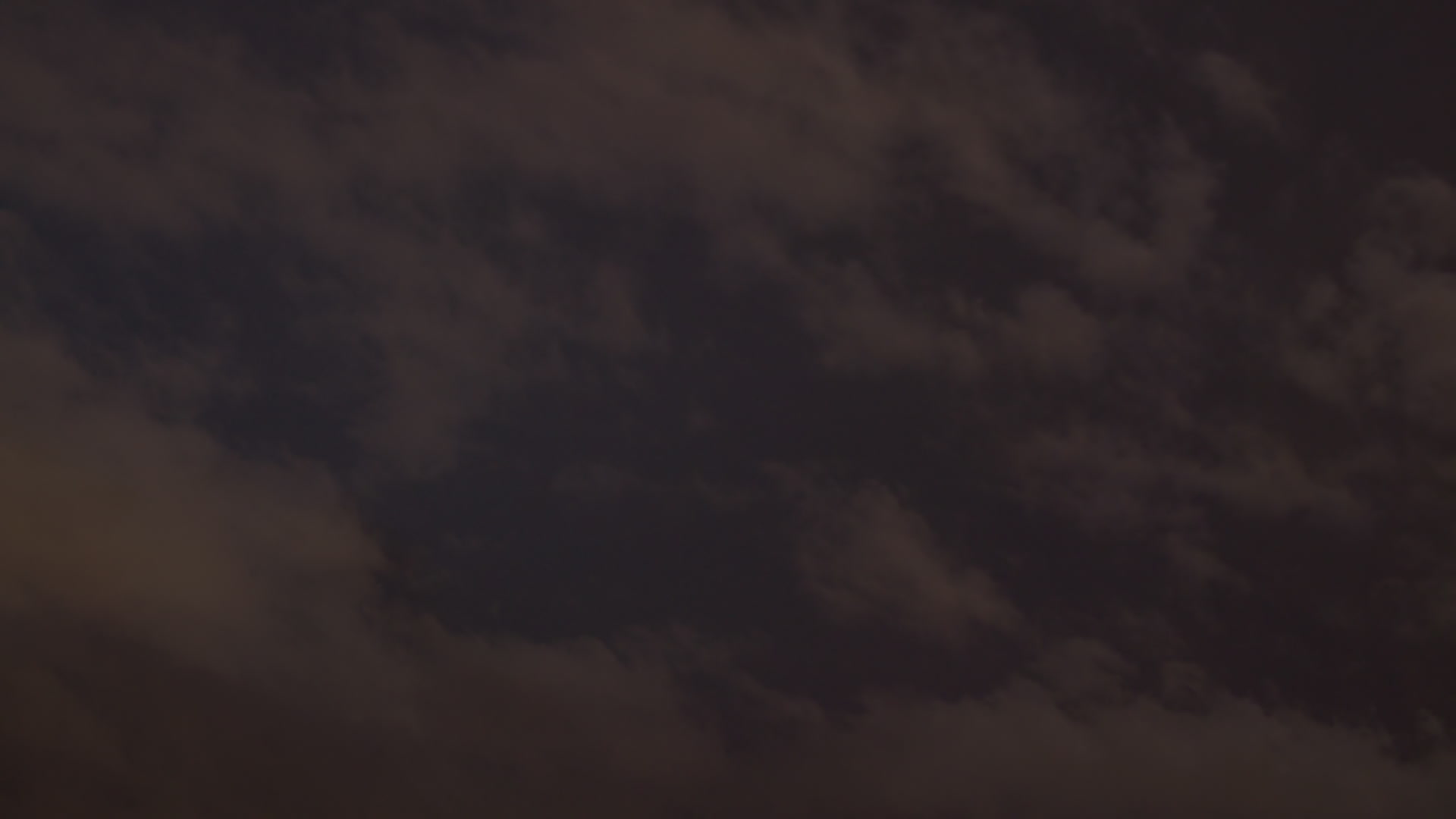 Continuous lightning above stratus at night