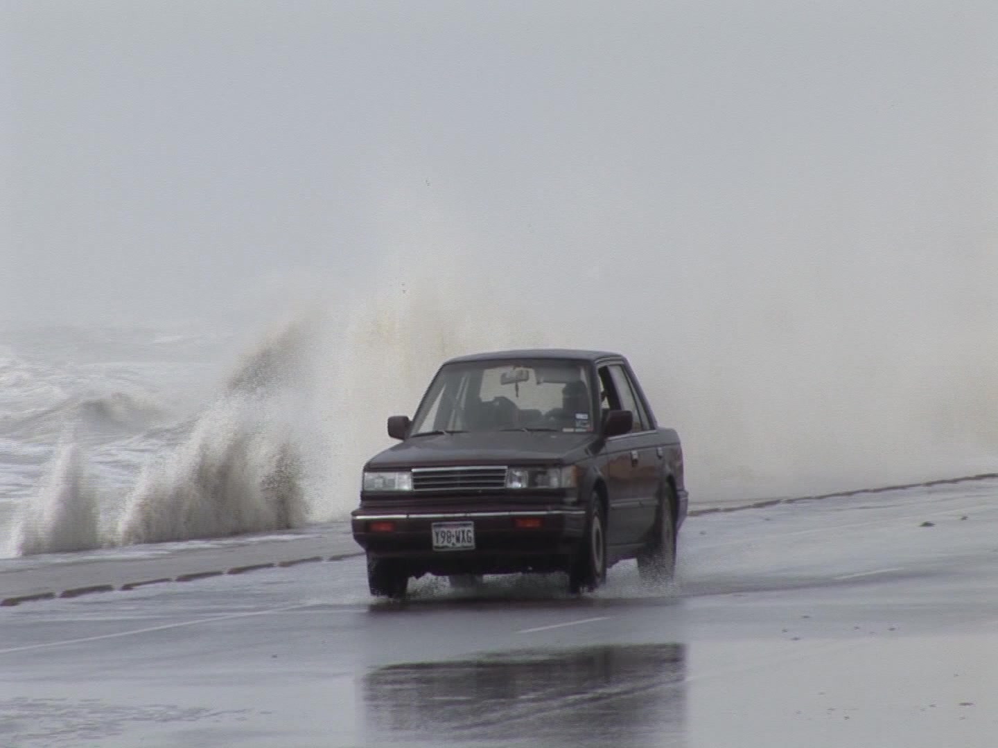 Powerful Hurricane Ike, Galveston, 2008 - big waves follow car