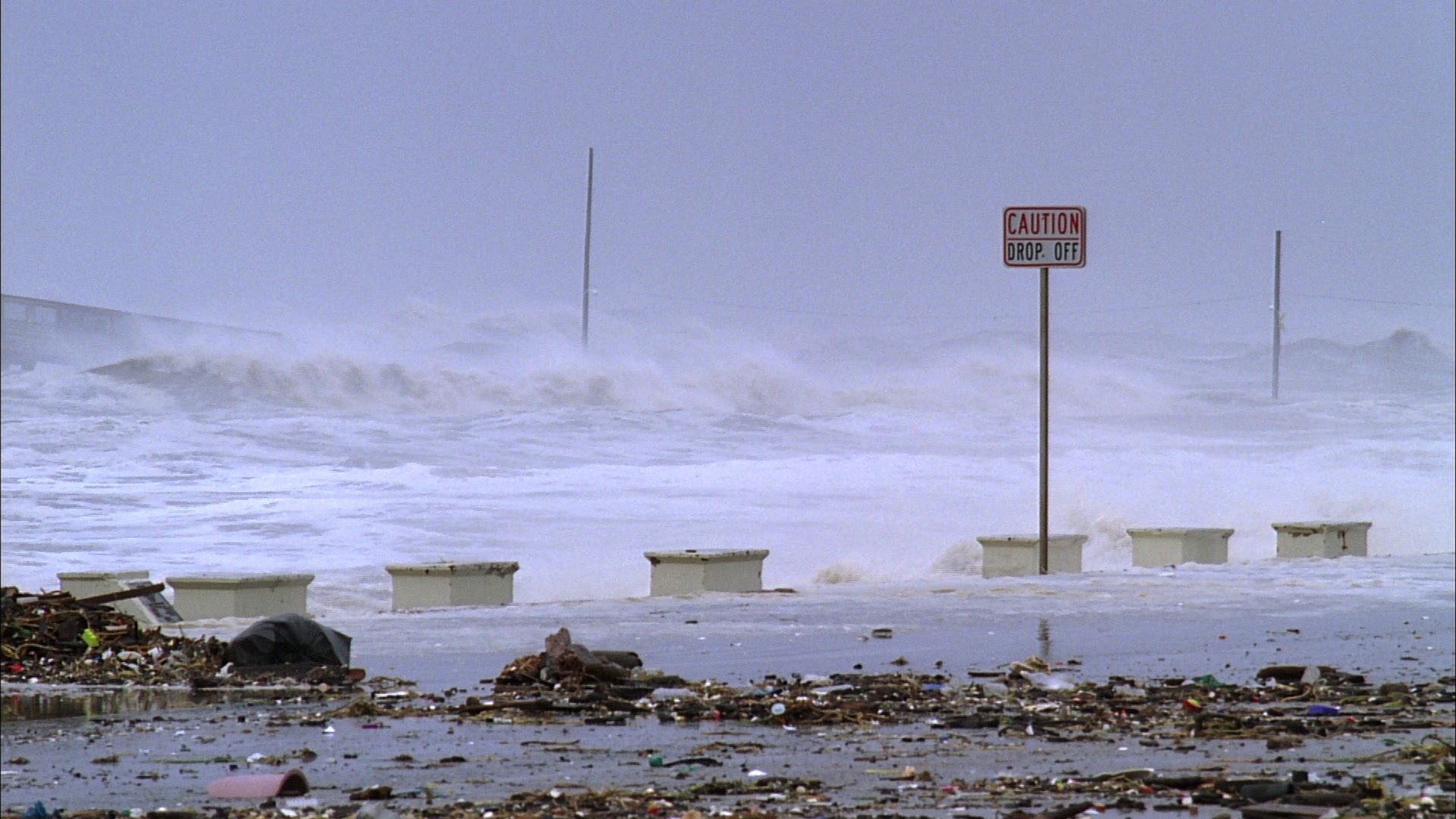 Powerful Hurricane Ike, 35mm film to 4K - huge waves crash against sea wall, warning sign