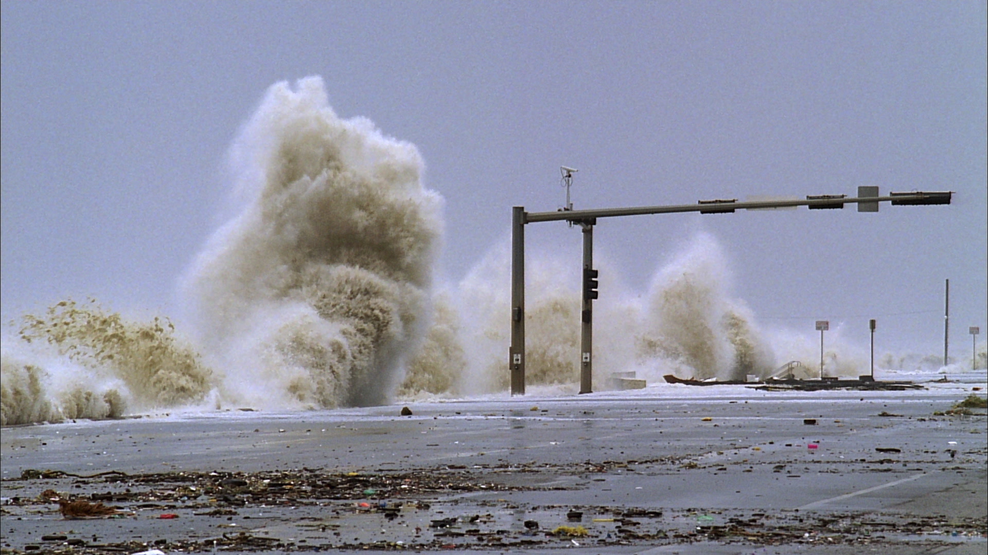 Powerful Hurricane Ike, 35mm film to 4K - huge waves crash against sea wall, traffic lights