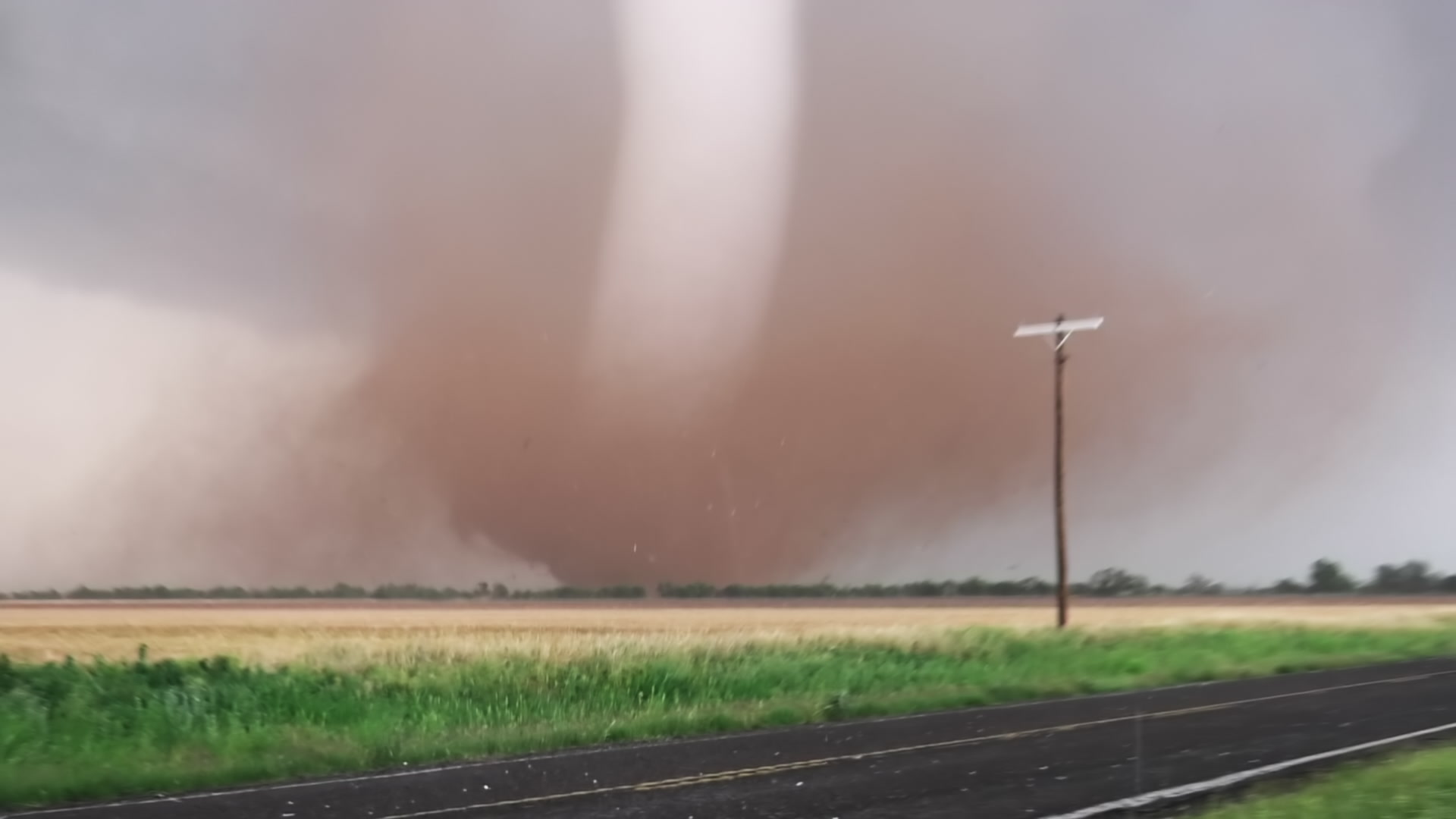 Dramatic Tornado - Tube shaped tornado tracks near Hawley, Texas near rural road, 4K