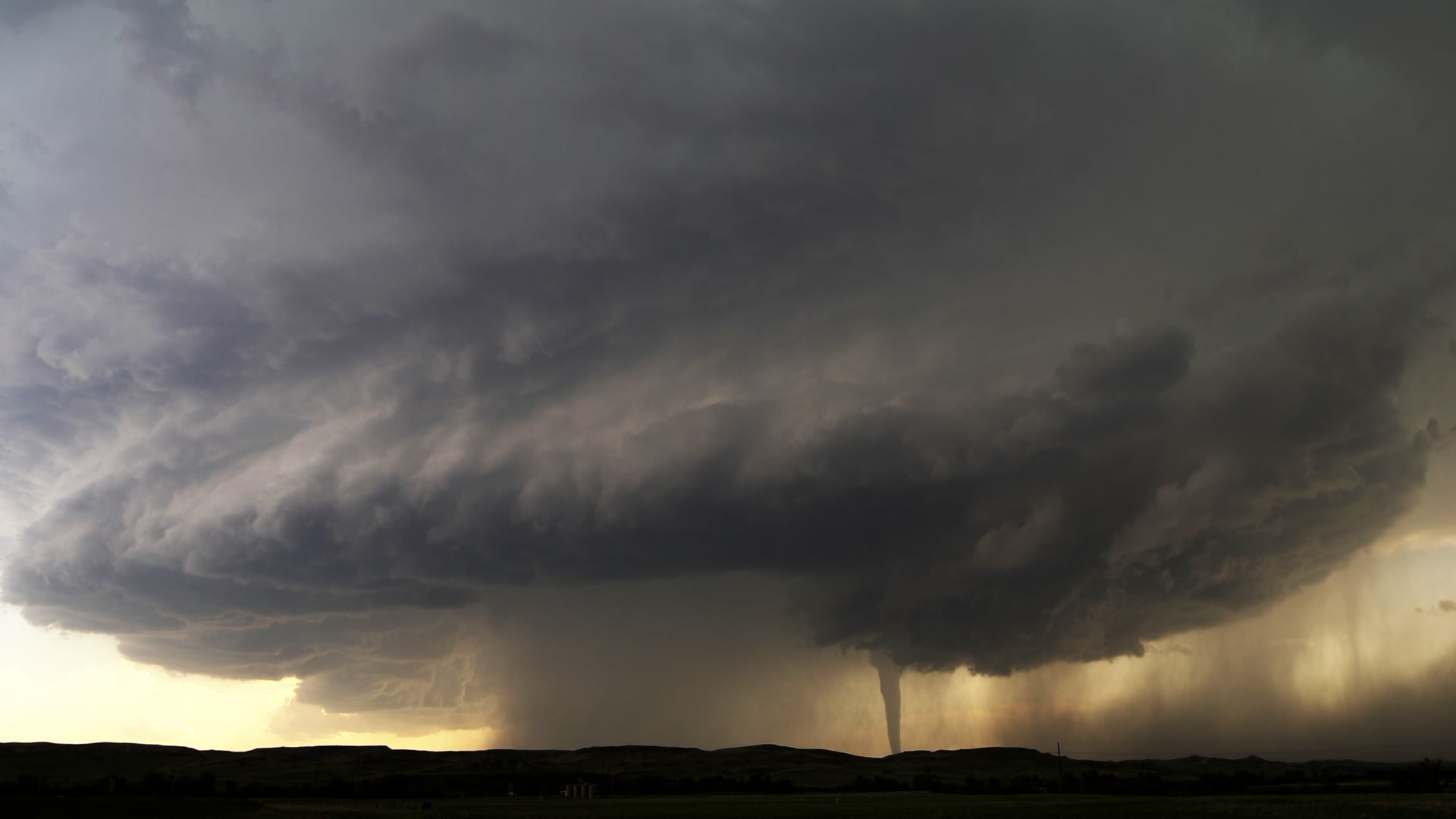 Dramatic Tornado - Tornado tracks beneath hugh supercell thunderstorm. North Dakota, 4K