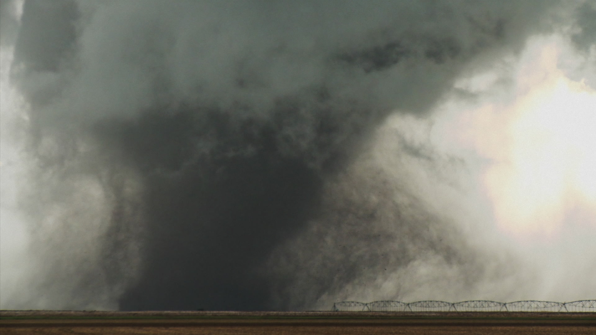 Oklahoma Tornado - Tornado cases behind irrigator, lightning