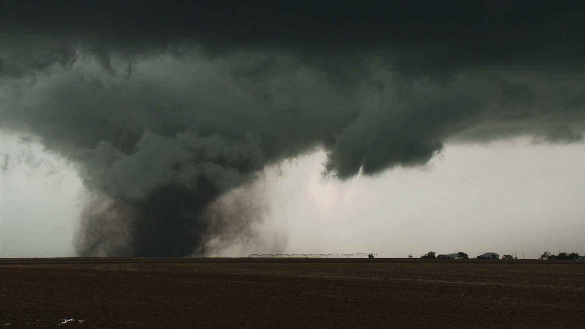 Oklahoma Tornado - Wide shot, zoom in, farm right
