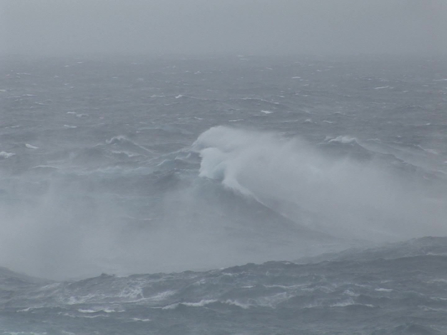Very large wave rolling during hurricane, ocean POV