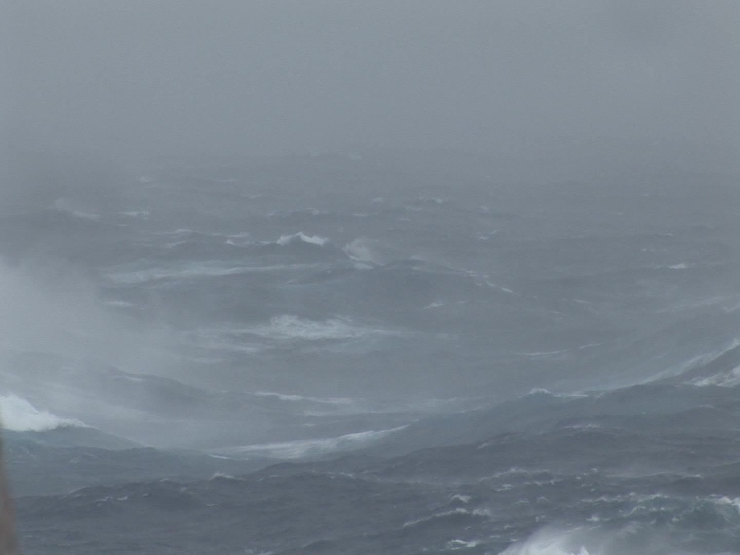 One large wave rolling during hurricane, ocean POV, close-up