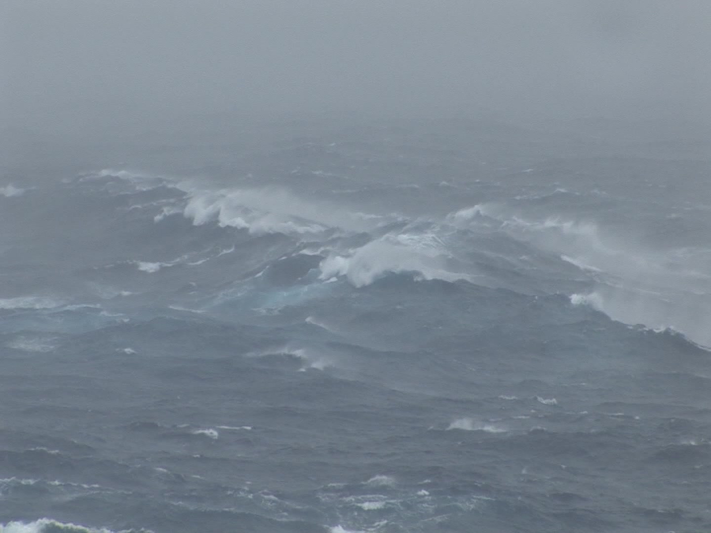 Big waves rolling during hurricane, ocean POV