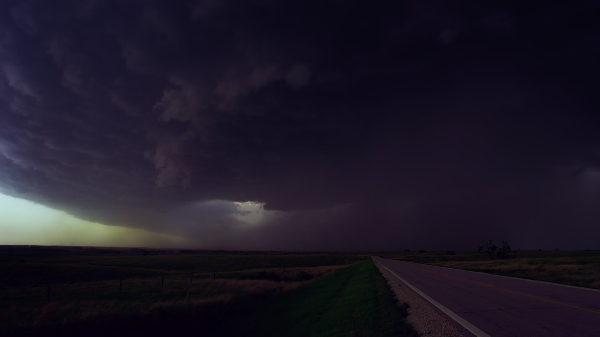 Storms on 35 - Lightning bolts strike the ground as cars escape massive supercell thunderstorm, Salina, Kansas