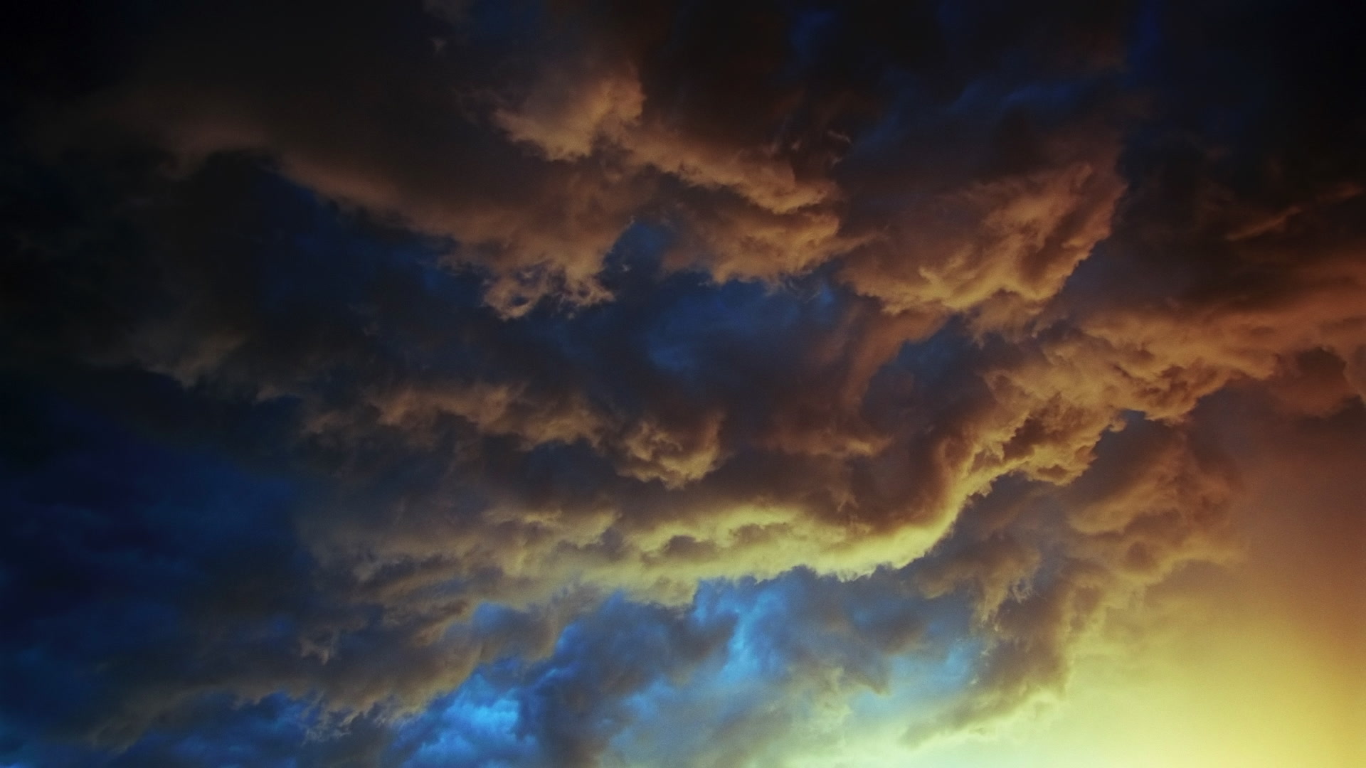 Storms on 35 - Inky orange and teal storm clouds with lightning