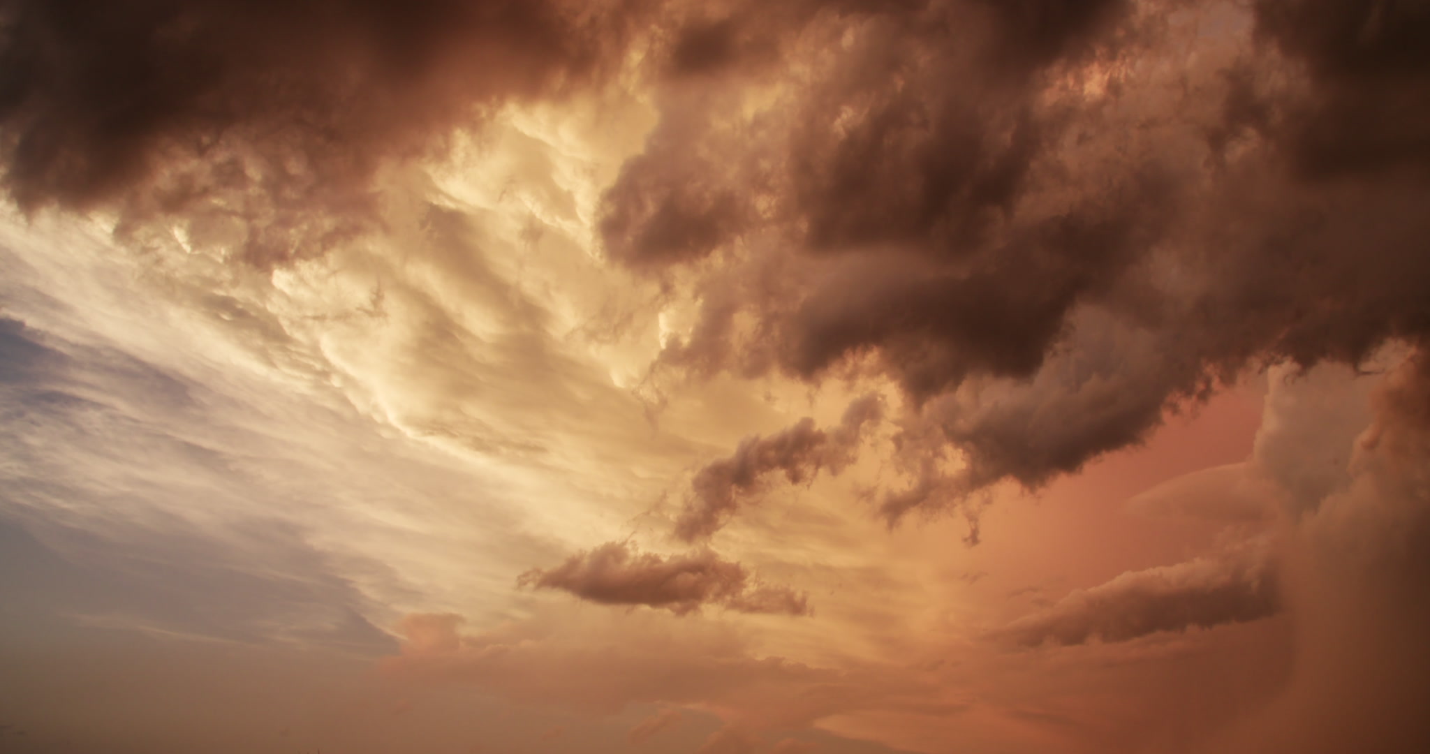 Storm clouds - Thunderstorm anvil painted gold at sunset, time-lapse, 4K