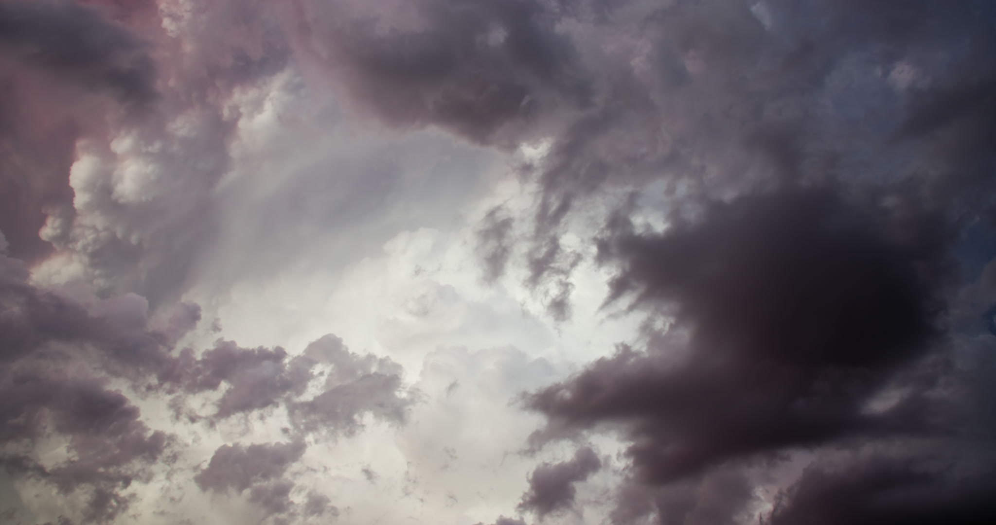 Storm clouds - Dark clouds cover thunderstorm tower, late day, time-lapse, 4K
