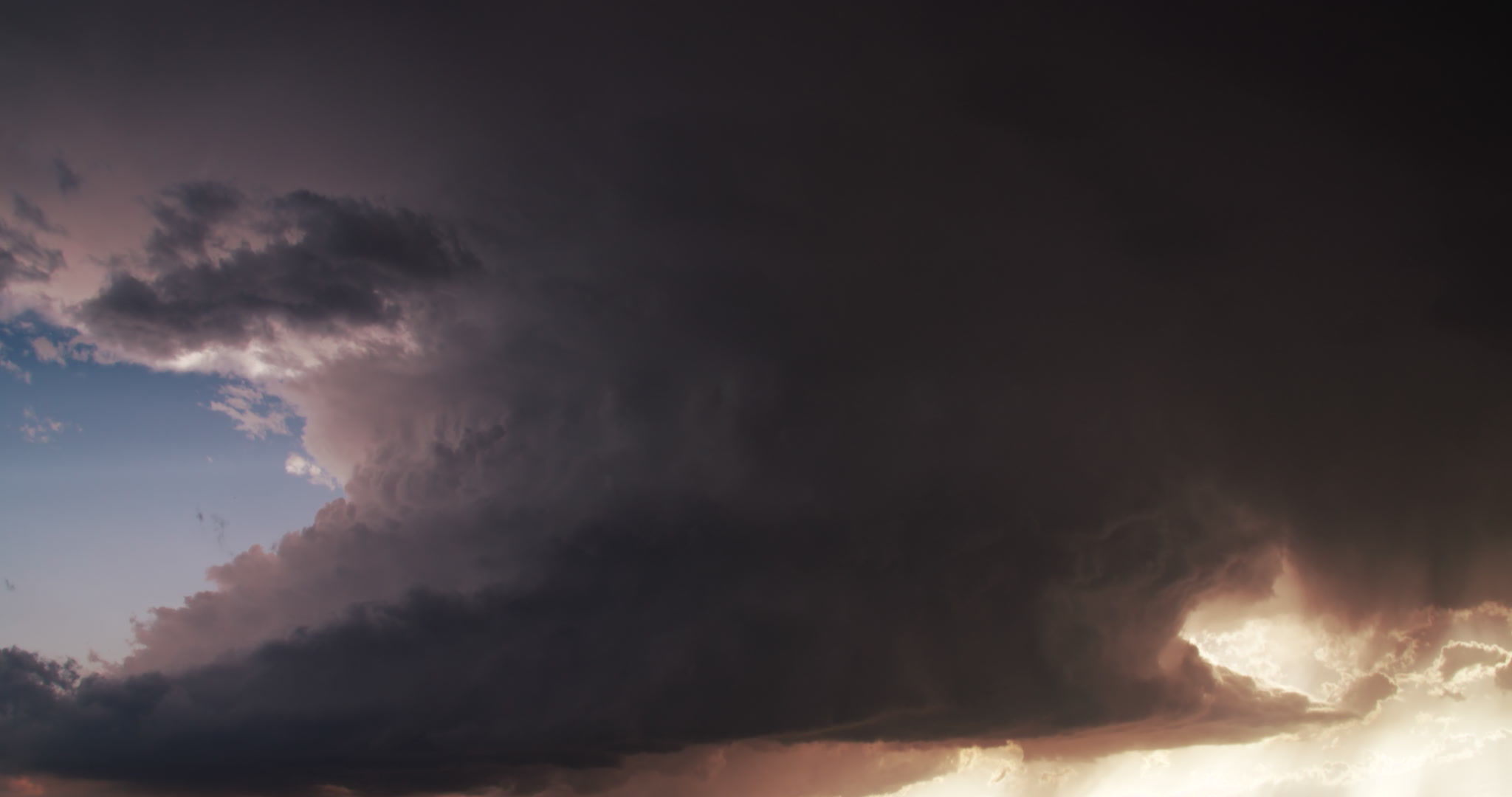 Storm clouds - Spinning supercell with lightning heads toward camera, late day, 4K, time-lapse