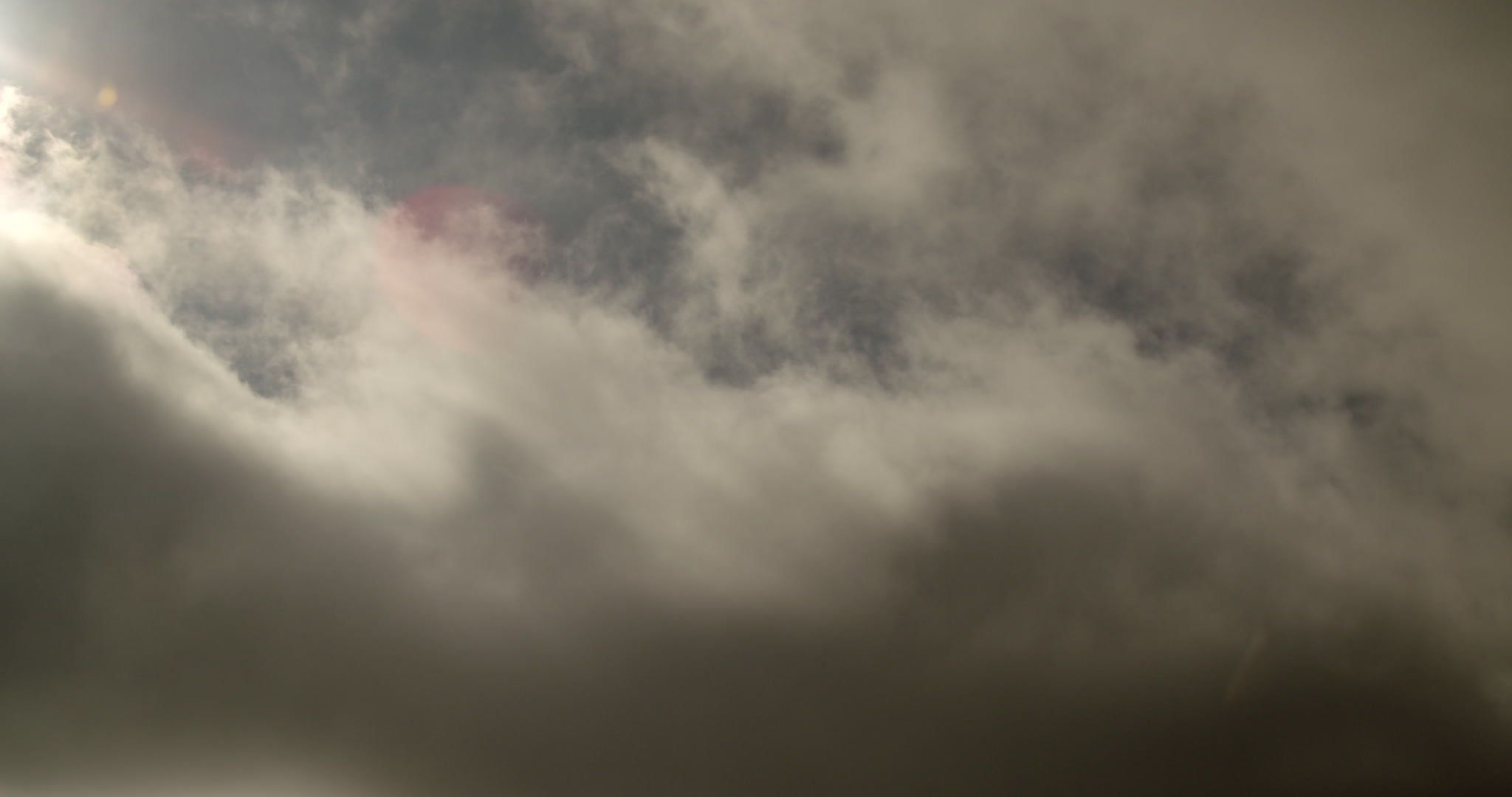 4K Storm Clouds - Golden, sunlight stratus clouds drift by