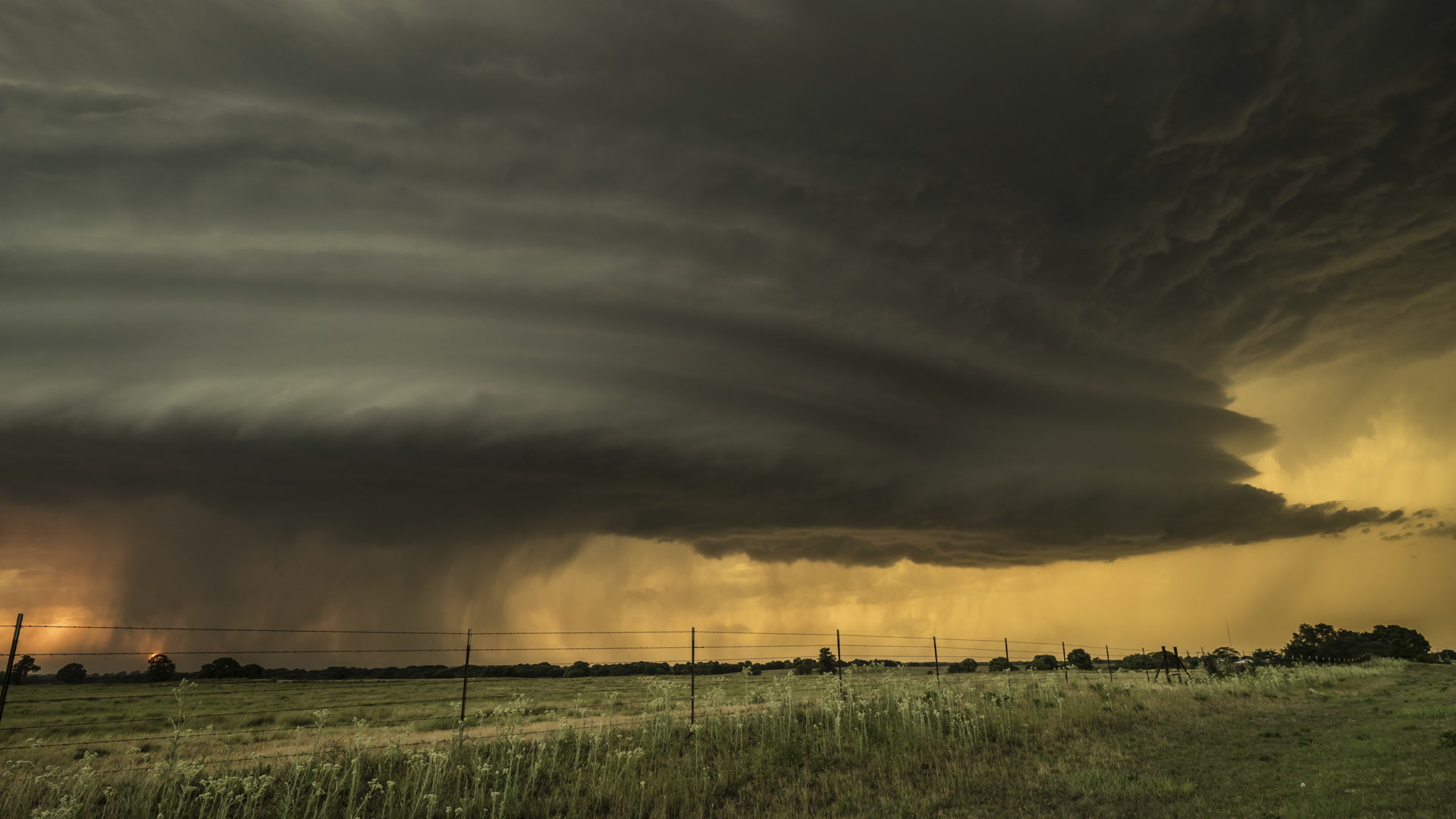 8K video - Stack of plates supercell thunderstorm at sunset, time-lapse