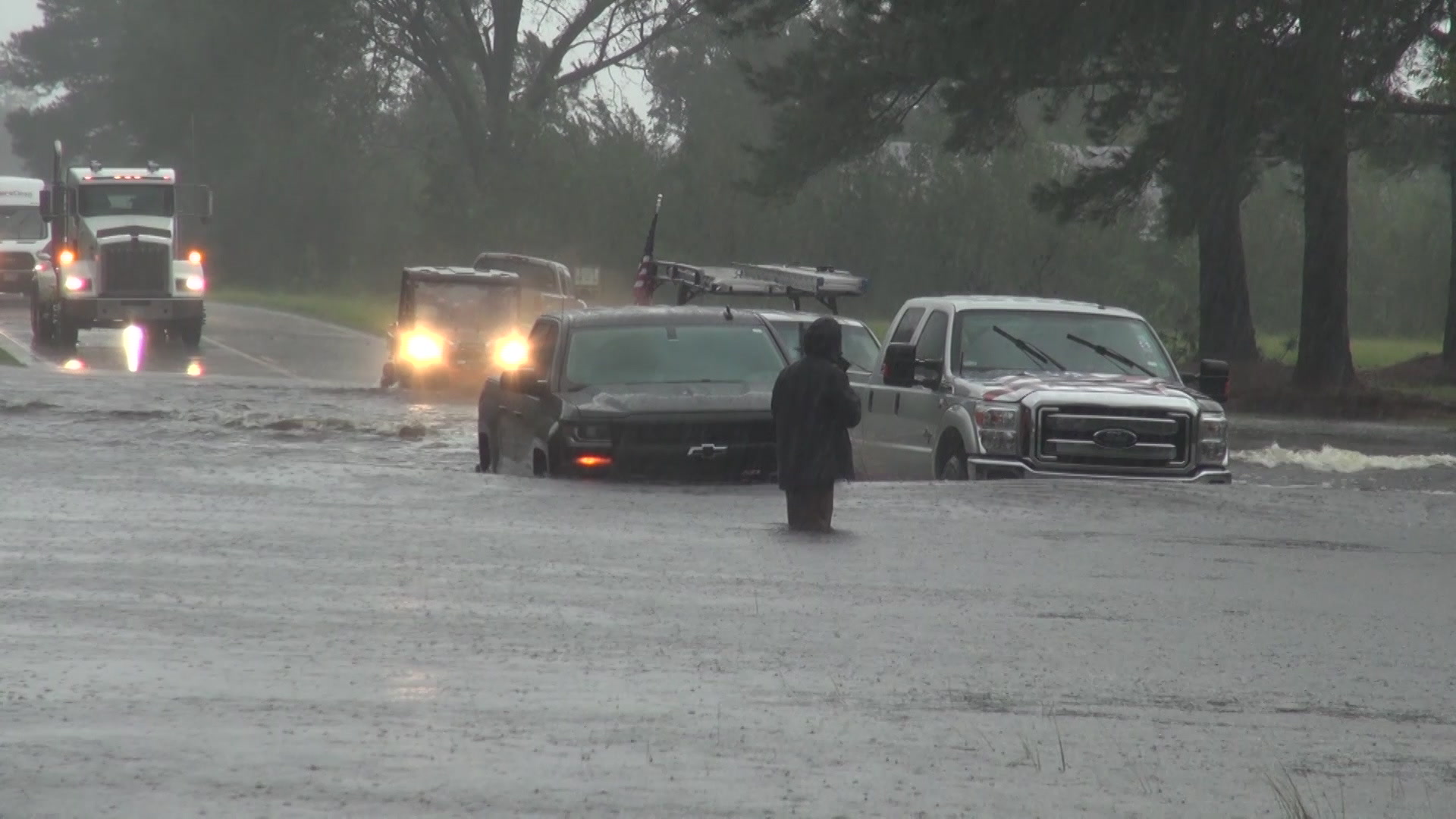 Man and car stranded on flooded street, Hurricane Florence, 2018