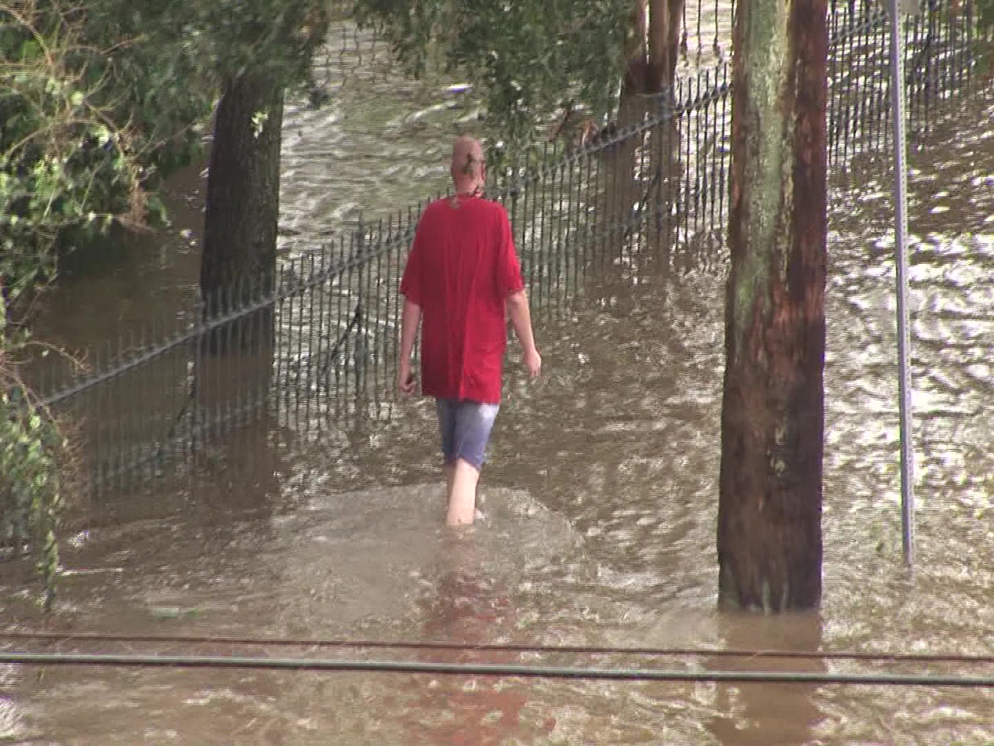 Powerful Hurricane Ike, Galveston, 2008 - Man walks down flooded street