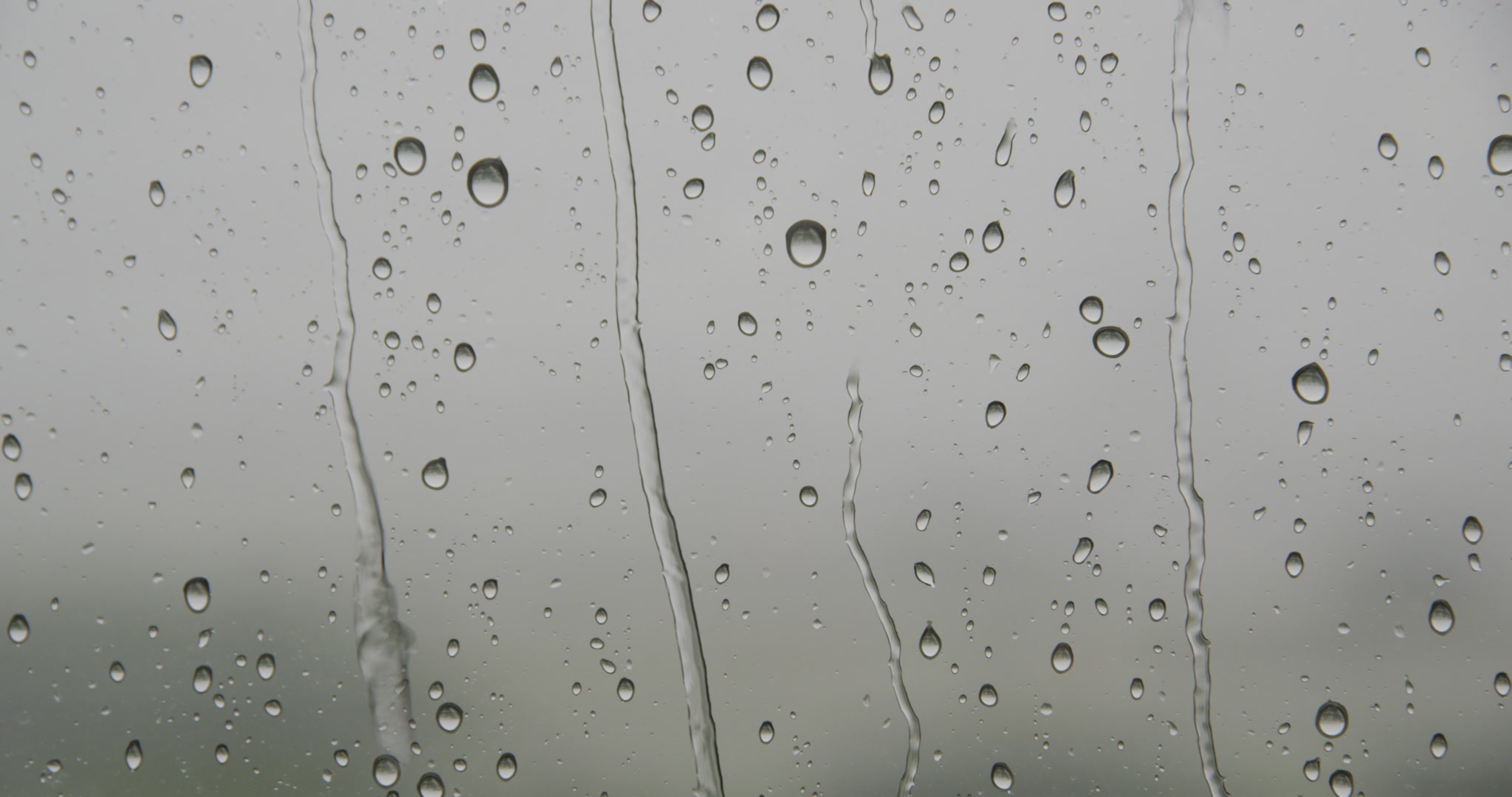 Rain storm - rain drops run down window, 4K