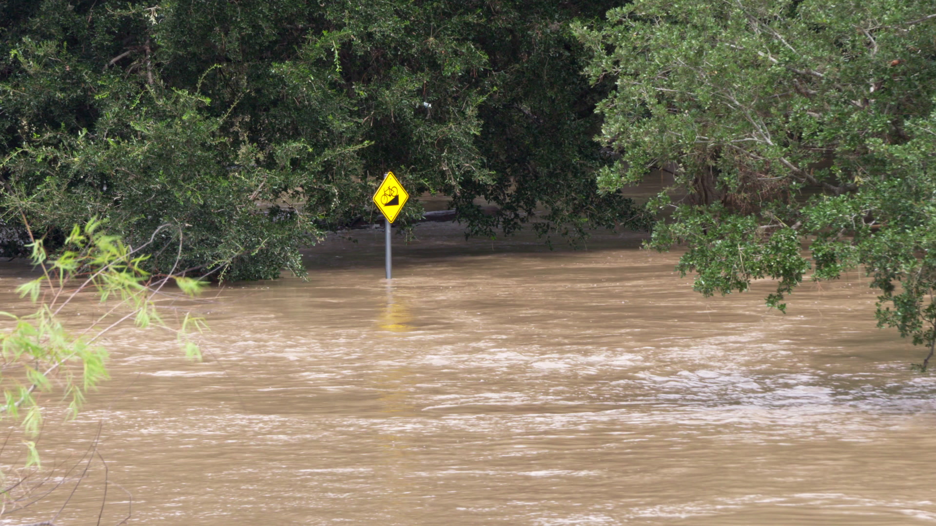 Hurricane Harvey - Flooded street and bike path sign, 4K