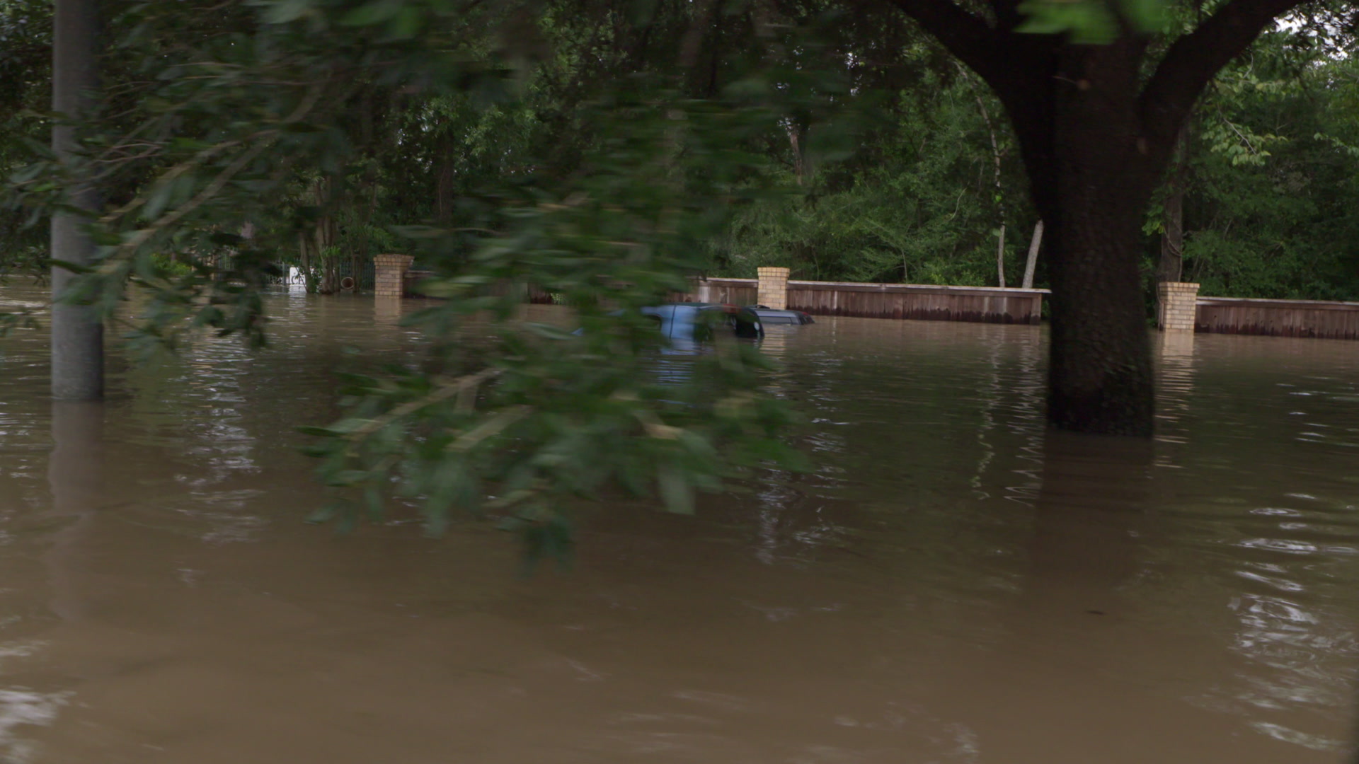 Hurricane Harvey - Boat POV of flooded street and cars, 4K