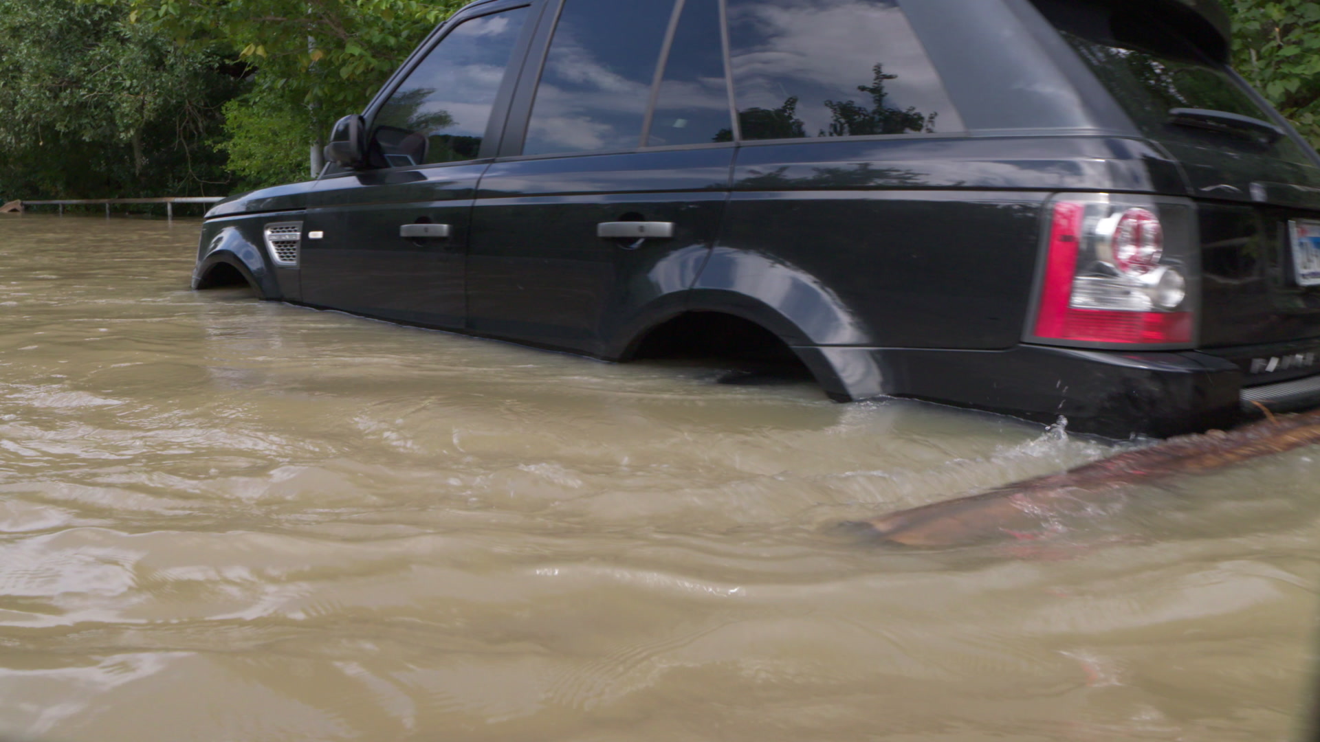 Hurricane Harvey - Boat POV of SUV on flooded street, 4K