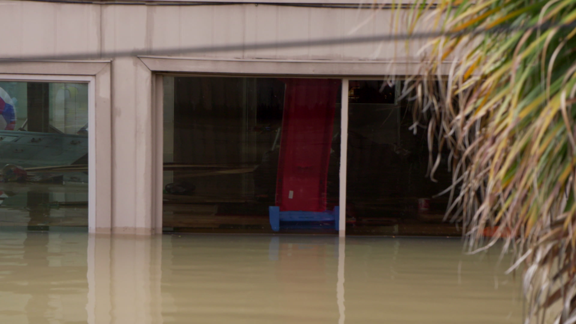 Close-up of flooded home, boat POV, Hurricane Harvey, Texas, 4K