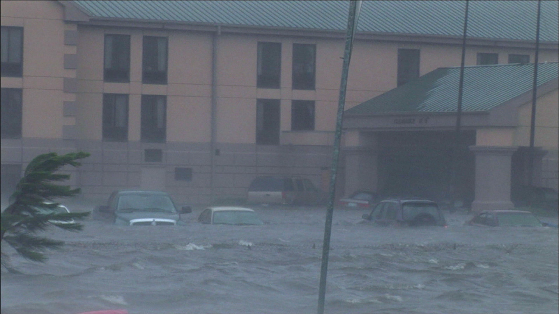 Intense wind and storm surge overtake hotel and cars, Hurricane Katrina, 4K