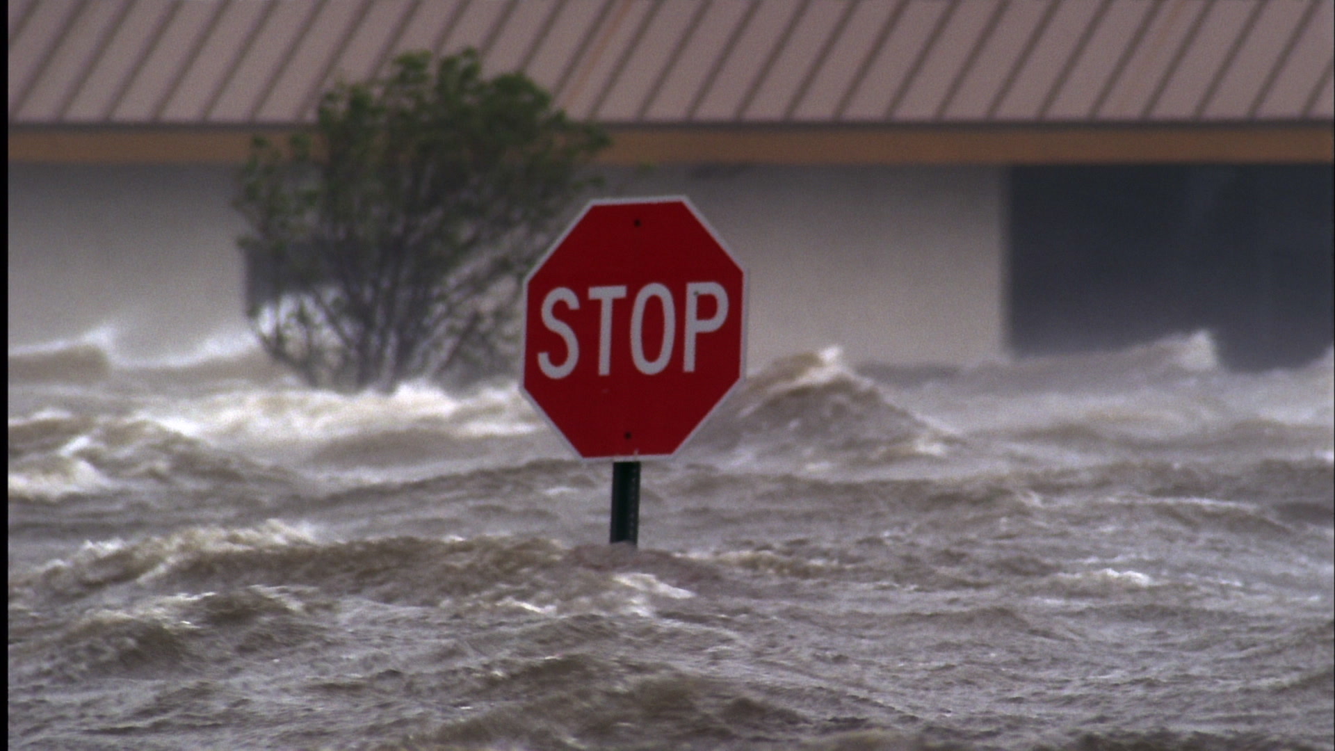 Stop sign caught in record breaking storm surge, waves, Hurricane Katrina, film
