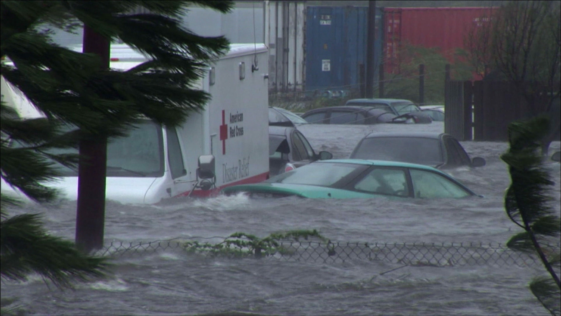 Intense wind, storm surge roll past flooded cars and Red Cross truck, Hurricane Katrina, 4K