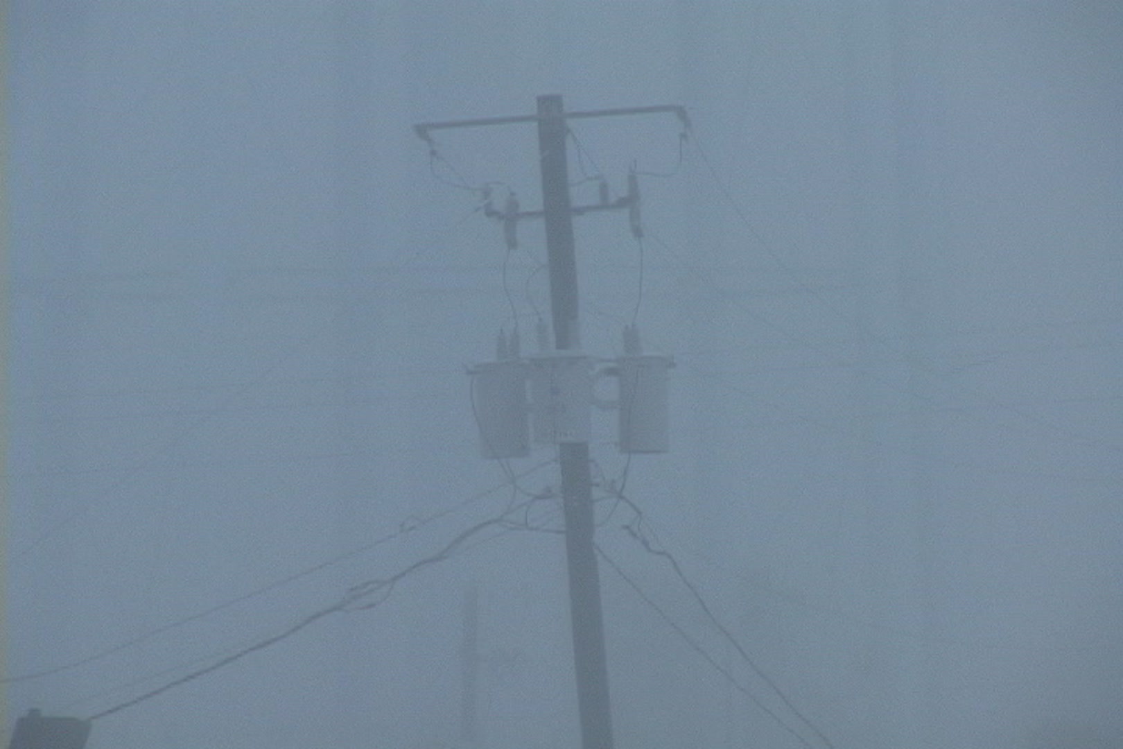 Utility pole sways, debris crashes, intense wind, rain, Hurricane Katrina
