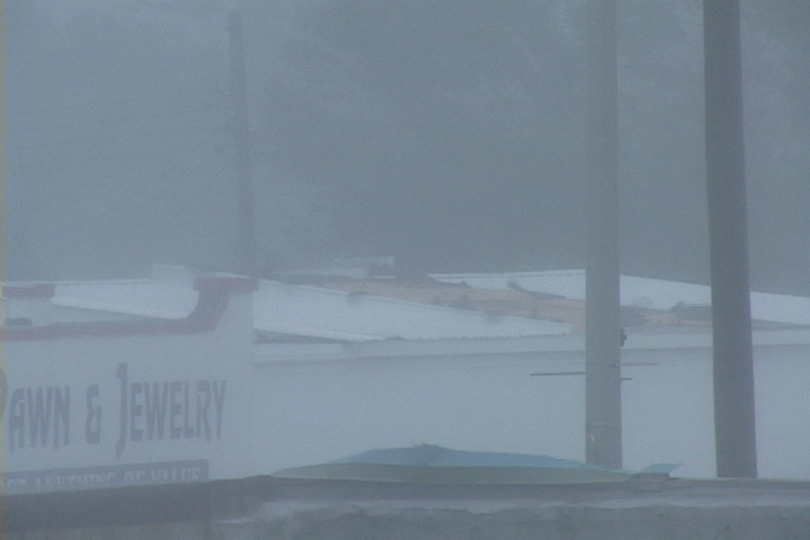 Roof starting to rip off building, Hurricane Katrina