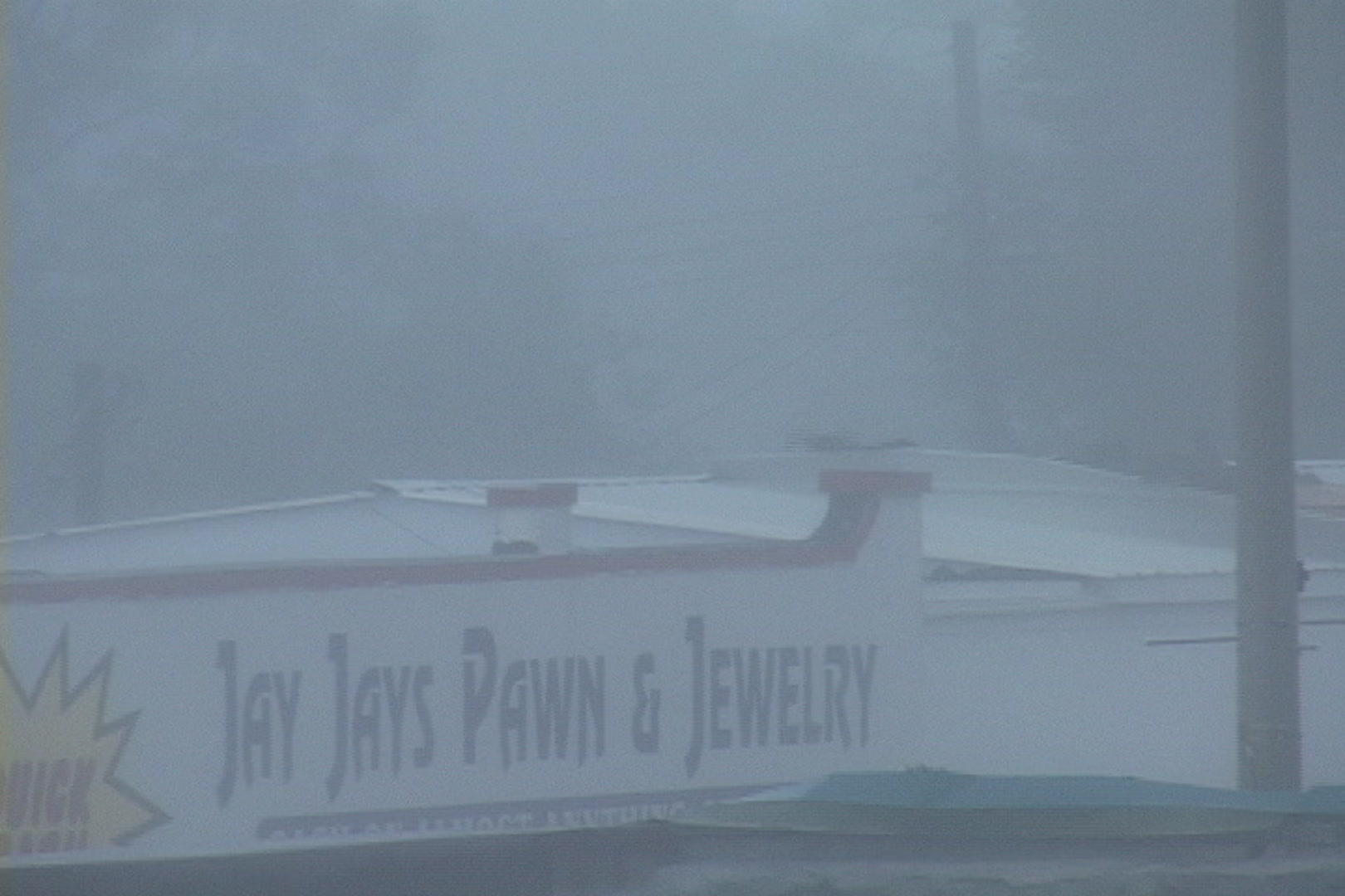 Very dramatic, unique shot of roof ripping off, Hurricane Katrina