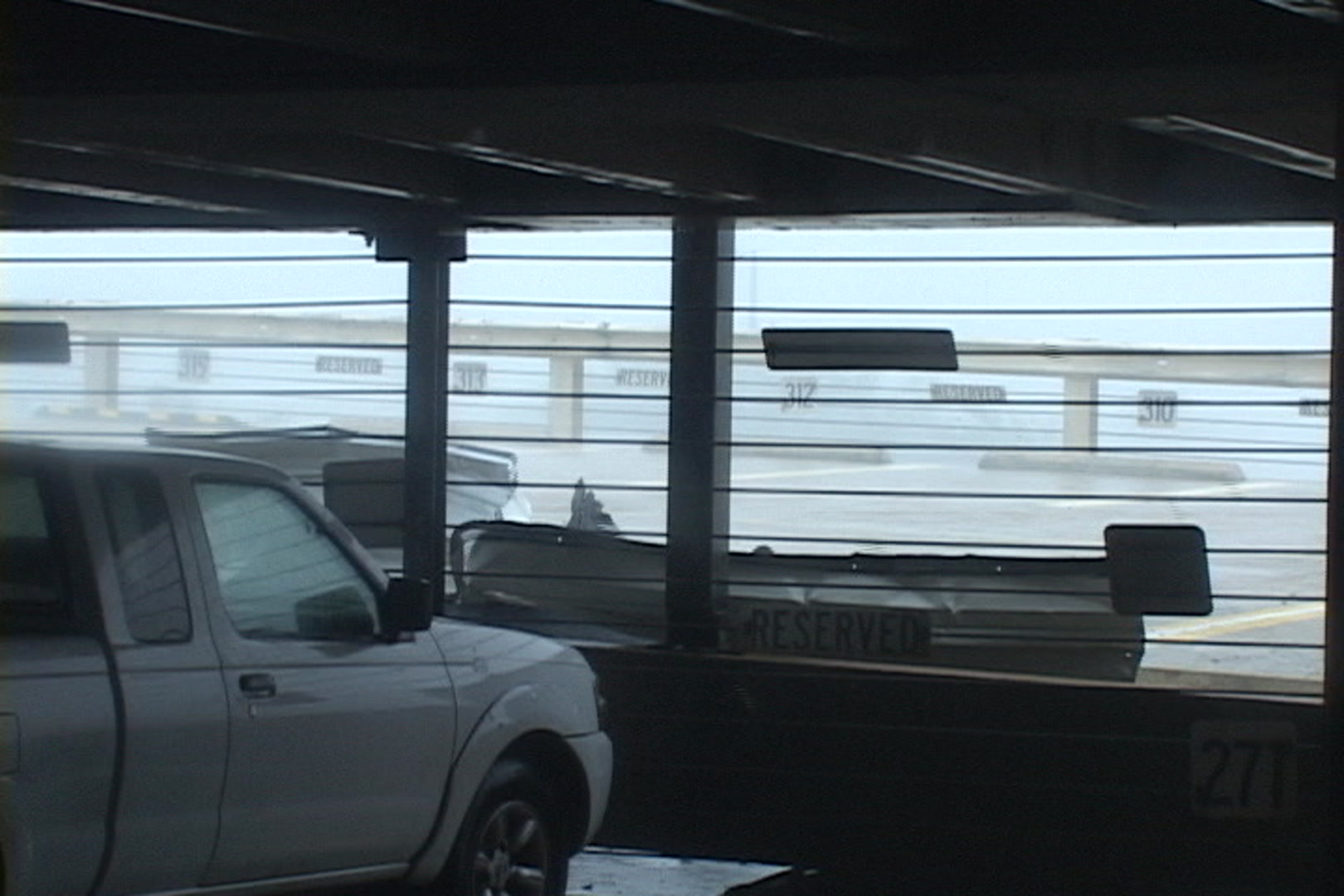 Crazy, dramatic shot of sheet metal crashing down, Hurricane Katrina