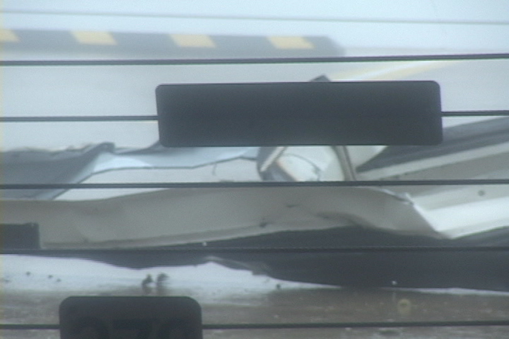 Sheet metal blows by during Hurricane Katrina