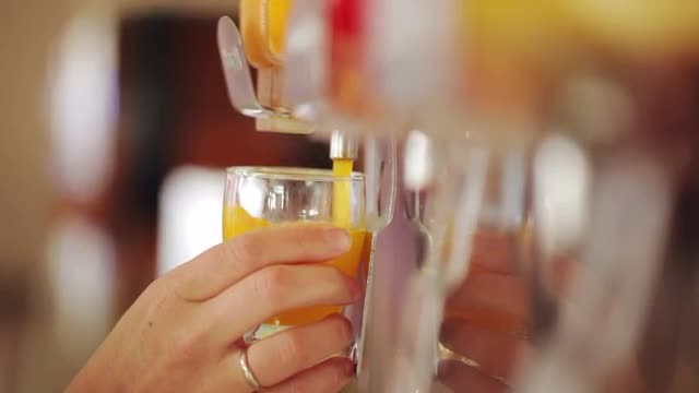 Juice pouring in slow motion