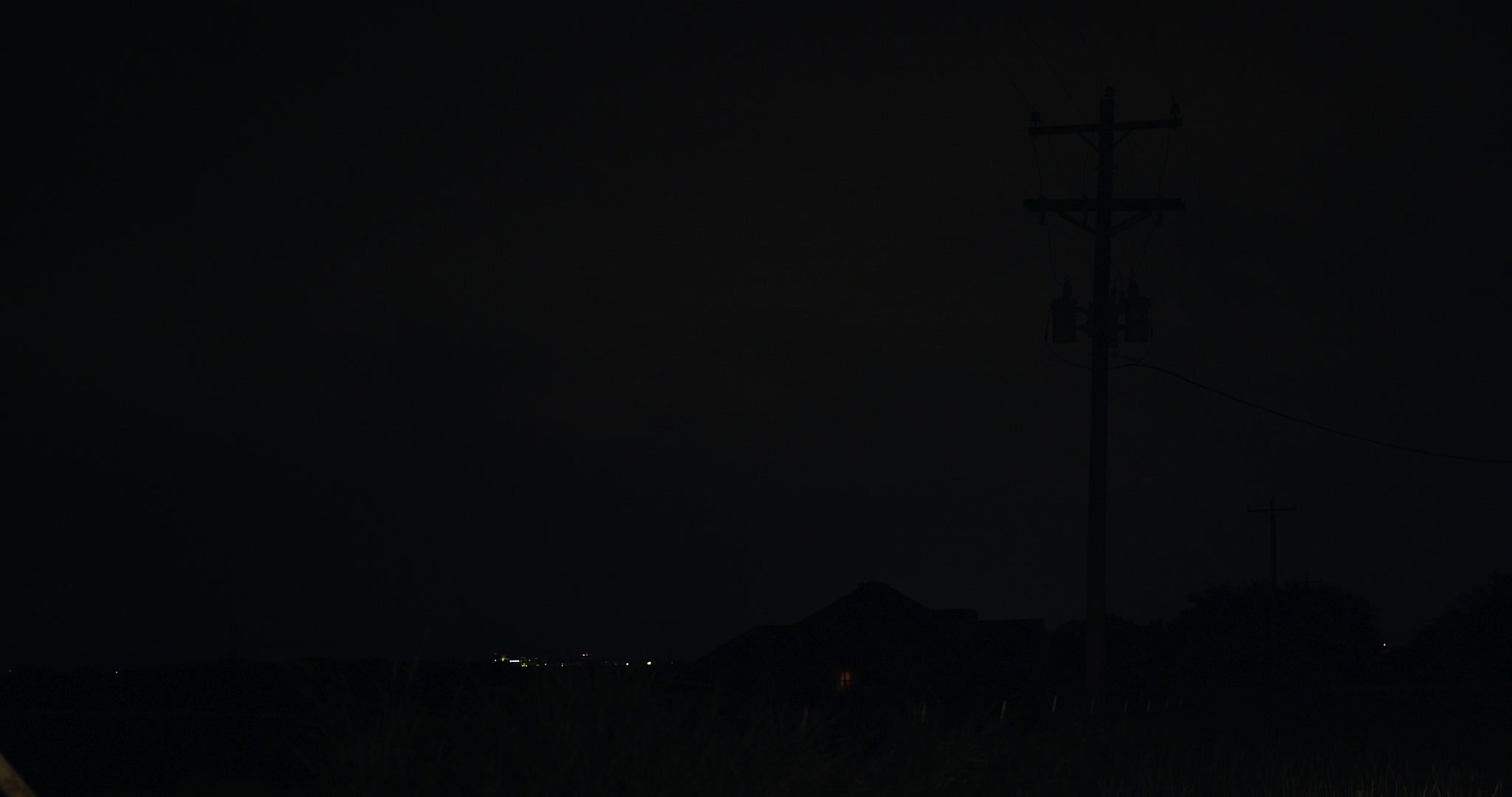 Lightning storm, flashes at night, over rural homes, Texas, 4K