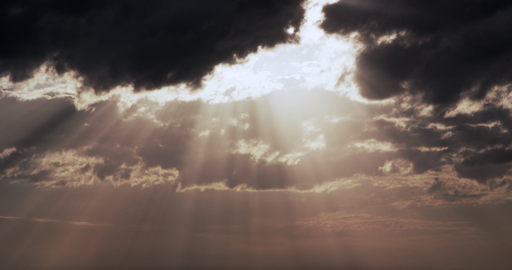 Big, golden sun beams shine down through storm clouds, 4K
