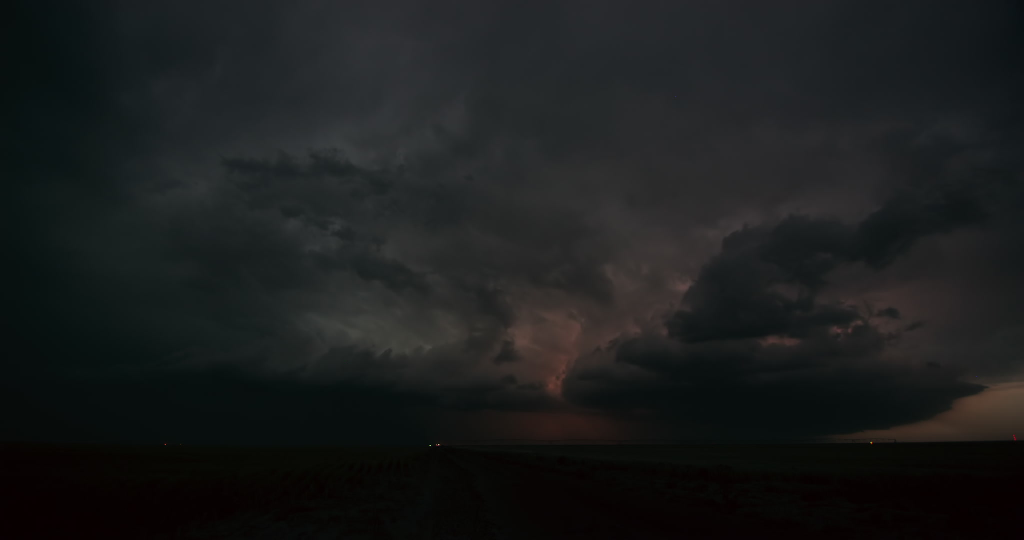 Lightning storm over rural road, dusk, Nebraska, 4K