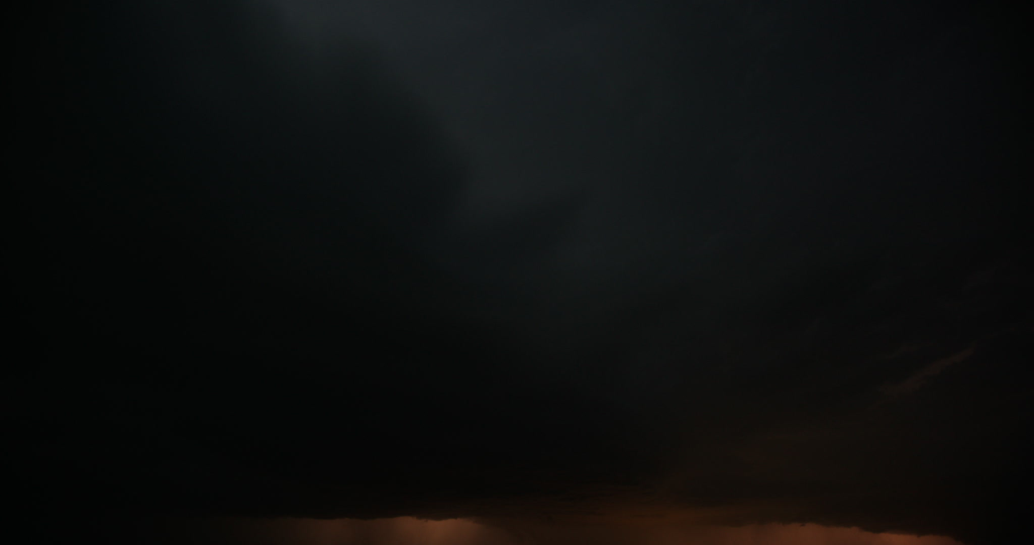 Lightning flashes between two storms, night, time-lapse, Nebraska