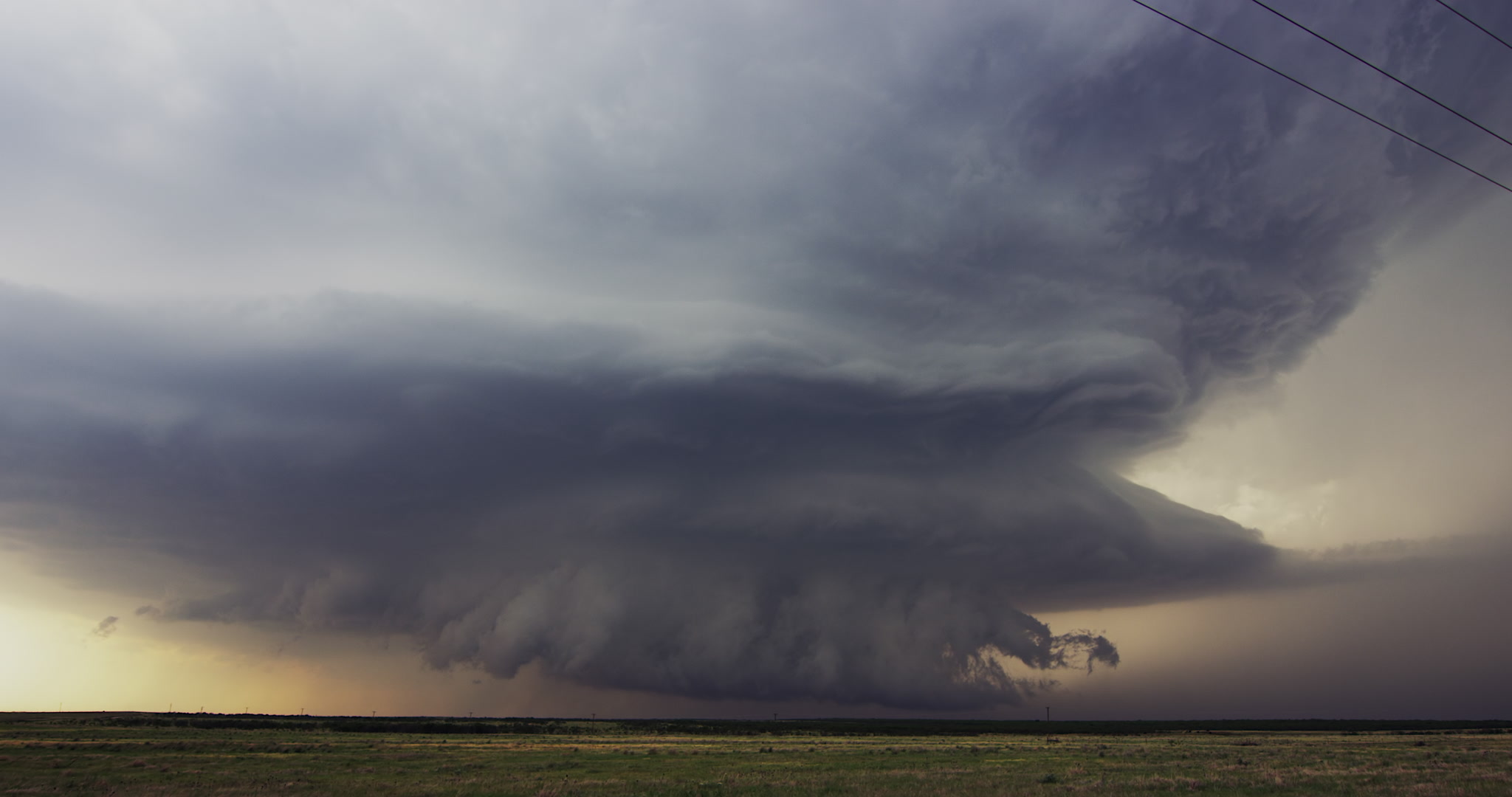 Pan right to large supercell thunderstorm, evening, real-time, Texas