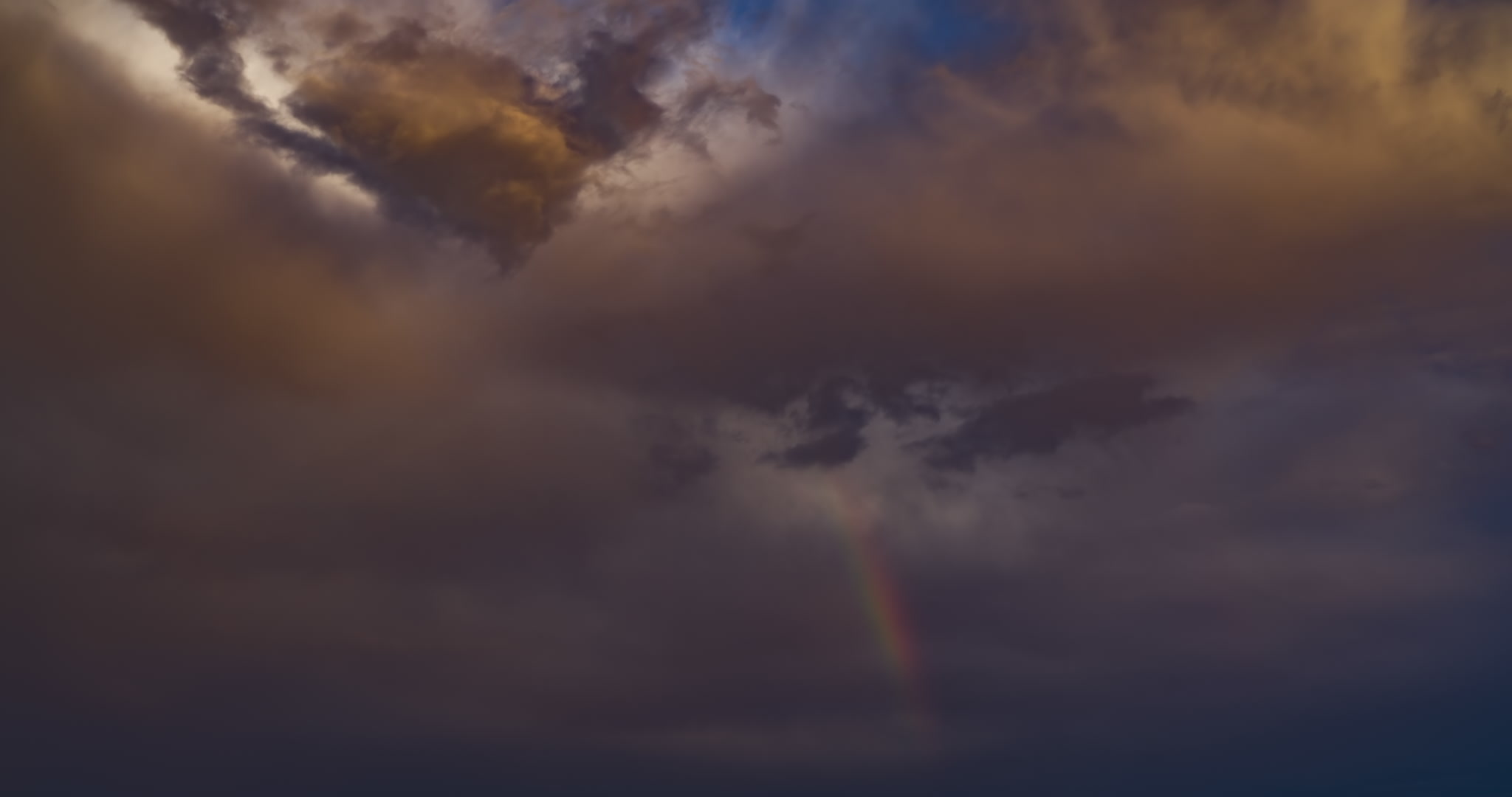 Rainbow time-lapse, stormy sky sequence, 4K