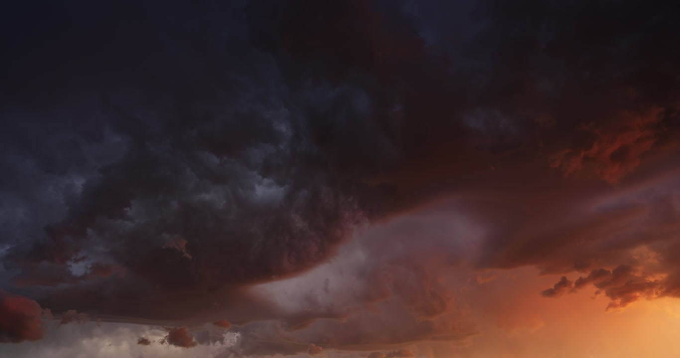 Slow time-lapse, stormy orange and teal sky, 4K