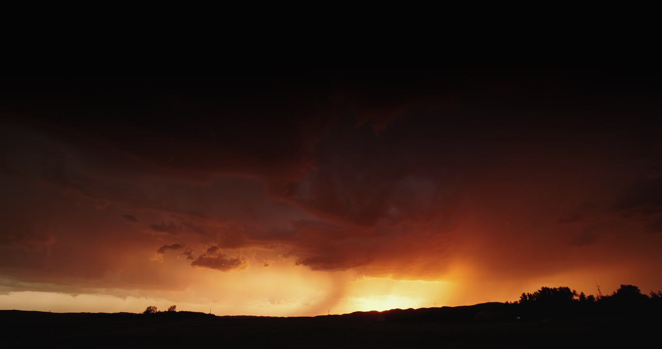 Orange stormscape with forked lightning, setting sun, Nebraska sand hills, 4K