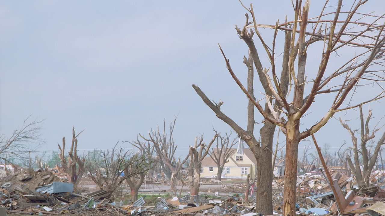 Tornado damage and aftermath - red debris truck goes by, stripped trees, Greensburg EF5 aftermath, 35mm film to 4K
