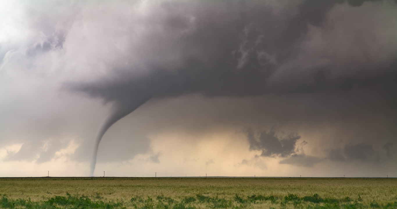 Tornado weaves and stretches over wheat, Holly, Colorado, 6K